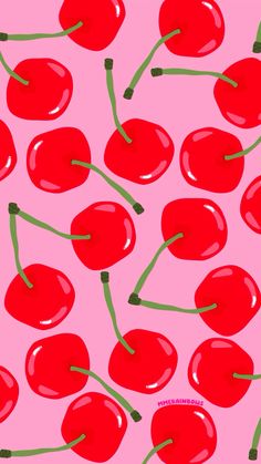 a pink background with red cherries and green stems