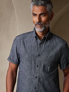 The quintessential chambray shirt, this all-year favorite shirt is crafted in our 100% cotton chambray that is specially washed for added softness.  UNTUCKED: Specially cut 1" shorter through the body for an untucked fit that still looks sharp.  Butt Summer Washed Shirt For Workwear, Summer Collared Chambray Shirt, Spring Washed Shirt For Casual Gatherings, Summer Chambray Collared Shirt, Spring Casual Washed Shirt, Casual Spring Washed Shirt, Chambray Top For Everyday Summer Wear, Summer Chambray Top, Spring Linen Tops