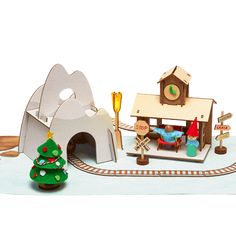 a wooden toy train set with a christmas tree