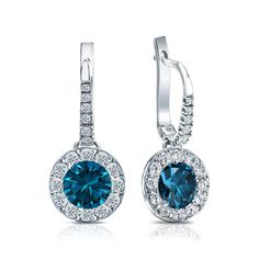 This luminous diamond earrings feature a 1.20 ct. total weight center stone in blue round cut diamond dangle studs halo setting in a glistening 18k white gold metal and with 0.90 ct. total weight of small dazzling round-cut diamonds as side stone totaling to 2.10 ct. Blue Diamond Earrings, Black Diamond Pendant, Black Diamond Studs, Halo Diamond Earrings, Solitaire Diamond Pendant, Colored Diamond Rings, White Gold Earrings Studs, White Gold Studs, Black Diamond Ring