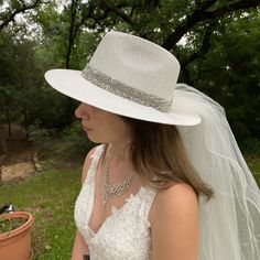 White Bridal Wedding Fedora Hat with Hat Band of Crushed Rhinestones. 36 Inch Two Layed Veil Accented with a Beautiful Rhinestone Bow This is a perfect Hat and Veil for a Church, Garden, Casual or Formal Wedding. This Accessory would complement any Bride and Her Wedding. One size fits most with a soft elastic band inside hat. Fitted Fedora Wedding Hat, Fitted Fedora Hat For Weddings, Elegant Fitted Fedora For Wedding, Elegant Flat Brim Fedora For Wedding, Elegant Wedding Fedora With Flat Brim, Wedding Fedora Fascinator For Kentucky Derby, Wedding Fascinator For Kentucky Derby In Fedora Shape, Elegant Short Brim Fedora For Wedding, Elegant Wide Brim Fedora For Wedding