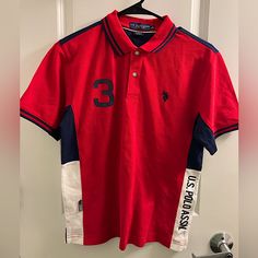 This Item Is New. Never Worn W/O Tags . No Stains. No Tears. In Excelente Conditions. I Ship Orders Within 1-2 Of Sale Date. Check Out My Other Items I Listed. I Post Newitems Every Day. Thank You Kindly And Hope You Are Having A Great Day! Red Collared Sports Top, Sporty Red Short Sleeve Polo Shirt, Red Sporty Polo Collar Top, Sporty Red Polo Collar Top, Casual Red Polo Shirt For Sports, Sporty Red Collared T-shirt, Sporty Red Top With Polo Collar, Red Cotton Polo Shirt With Graphic Print, Red Graphic Cotton Polo Shirt