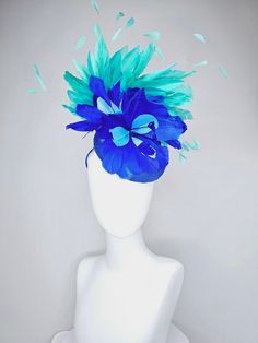 From the 2024 Featured Milliner of the Kentucky Derby Museum  Gorgeous Kentucky Derby hat fascinator  kentucky derby hat fascinator royal blue satin with green feathers and blue green feather flowers  headband attachment.  each hat is totally one of a kind! no two are alike! I can probably add feathers, flowers etc to existing hats for a small fee. I cannot remove anything from existing hats. Just message me and see if we can make it work! :) I cannot make custom order from scratch. My schedule Blue Fascinator For Kentucky Derby Races, Blue Costume Hats And Headpieces For Kentucky Derby Races, Blue Costume Hats For Kentucky Derby Races, Blue Costume Hats And Headpieces For The Kentucky Derby, Blue Headpieces For Kentucky Derby Races, Blue Fascinator For Royal Ascot, Blue Headpieces For Royal Ascot, Blue Mini Hat With Feather Trim For Kentucky Derby, Blue Feathered Costume Hats And Headpieces For Spring