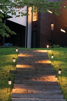 some steps lit up with lights in front of a house