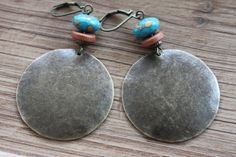 "These boho dangle earrings are made with antique brass discs that I hammered first, then to give more texture and character, I domed them. I added some brown earthy ceramic discs and some blue orange brownish beads on the top.  Color : Blue Orange brown rondelle beads ( 8x5 mm ) Finish : Antiqued Brass disc round hammered and hand domed by myself  1\"1/4 ( 32 mm)  Length : 2\" 1/4 including the antiqued brass lever back For more choices on my brass boho earrings, please refer to the link below Bohemian Beaded Round Earrings, Bohemian Bronze Metal Earrings, Nickel Free Bohemian Drop Earrings, Nickel-free Round Bohemian Earrings, Turquoise Soldered Brass Earrings, Soldered Turquoise Brass Earrings, Nickel Free Bohemian Brass Earrings, Nickel-free Bohemian Brass Earrings, Bohemian Round Brass Beaded Earrings