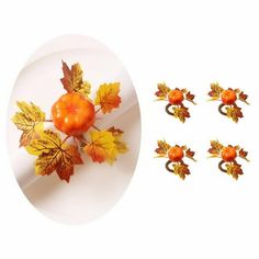 a white plate topped with lots of autumn leaves and oranges on top of it