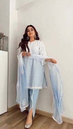 PRODUCT DETAIL: This comfortable and airy suit set is handcrafted using soft cotton fabric, featuring a beautiful ombre shading that's complemented by delicate lace detailing. The elegant embroidery and cutwork add to its charm, while the set is completed with a pair of stylish tulip pants and a dupatta that's enhanced with block printed motifs. A must-have addition to your wardrobe! SPECIFICATIONS: Color Powder Blue Fabric Cotton Product Code Gul25 Suits For Women Indian, Tulip Pants, Lace Suit, Trendy Suits, Pakistani Fancy Dresses