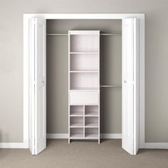 an empty closet with white shelves and open doors in a room that has carpeted flooring