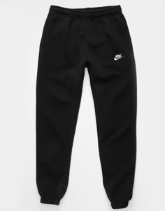 Nike Sportswear Club Fleece Sweatpants. Combines classic style with the soft comfort of fleece. Standard fit has a relaxed, easy feel. Tapered leg. Elastic waistband. Side pockets. Embroidered logo on left leg. Elastic cuffs. Fleece lining. 80% Cotton 20% Polyester. Machine wash. Imported. Nike For Women Clothes, Nike Oversized Sweatpants, Joggings Nike, Tuta Nike, Nike Trousers, Nike Hose, Nike Trackies, Black Nike Pants, Nike Items