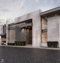 an architectural rendering of a modern building with stone and brick exterior, along side a cobblestone driveway