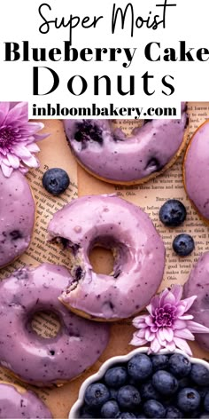 blueberry cake doughnuts with fresh blueberries on top and the words, super moist blueberry cake donuts