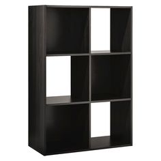 a black bookcase with four square sections