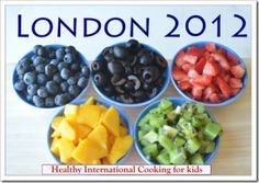 four bowls filled with different types of fruit on top of a wooden table next to a sign that says rio 2016