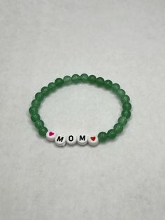 Elegant Mother's Day Bracelet - Ideal for gifting Casual Jade Beaded Bracelets Gift, Casual Jade Beaded Bracelet Gift, Mother's Day Gift Charm Bracelet With Round Beads, Personalized Green Name Bracelet As Gift, Personalized Green Name Bracelet For Gift, Personalized Green Bracelets As Gifts, Casual Stretch Bracelet With 8mm Beads As Gift, Casual Stretch Bracelet With 8mm Beads For Gifts, Casual Jade Jewelry With 8mm Beads