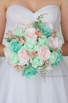 a bride holding a bouquet of flowers in her hands