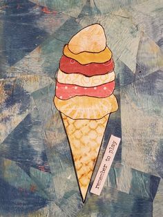 an ice cream cone is on top of a piece of paper