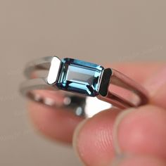 This is a gorgeous handmade creation. Its beauty is its simplicity & Elegance. The 7X5mm Emerald cut lab alexandrite is crafted in solid sterling silver and with rhodium plated. It is available to customized, if you have any mind, just let me know, we will discuss with it. All item is sent in a beautiful gift box You can realize more lovely stuff clicking the link https://www.etsy.com/shop/knightjewelry?refshopsection_shophome_leftnav Please leave the correct address and you PHONE NUMBER for del Modern Sterling Silver Emerald Cut Sapphire Ring, Modern Sterling Silver Emerald Ring For Anniversary, Modern Sterling Silver Topaz Ring With Prong Setting, Ring Double Band, June Birthstone Ring, Ring Emerald Cut, Sterling Silver Promise Rings, Alexandrite Ring, Ring Emerald