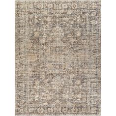 an area rug with various colors and patterns on the floor, including beiges, browns, and greys