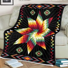 a colorful star quilt on a chair in front of a white couch with a book