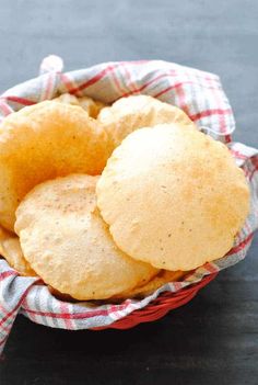 some type of bread in a basket on a table