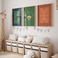 a child's sports themed room with posters on the wall and stuffed giraffe