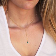 "Our lariat necklace is perfect minimalist jewelry. This dainty necklace is perfect with your favorite tee or your little black dress. A natural turquoise drop adorns a 14kt gold filled satellite chain.  D E T A I L S *Natural Arizona turquoise chips *2 inch drop  *Dainty satellite chain *100% 14kt gold dainty link chain  LENGTH *The standard length is normally 18\". *Model is wearing a 16\" in Photos. HOW TO PERSONALIZE *Select your choices from the drop down menu to create your custom design. Adjustable Dainty Lariat Necklace, Turquoise Lariat Jewelry With Adjustable Chain, Turquoise Lariat Necklace As A Gift, Turquoise Lariat Necklace Gift, Turquoise Lariat Necklace With Adjustable Chain, Elegant Turquoise Lariat Necklace With Adjustable Chain, Elegant Turquoise Lariat Necklace For Gift, Necklace Minimalist Jewelry, Dainty Necklaces