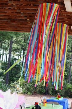 colorful streamers are hanging from the ceiling