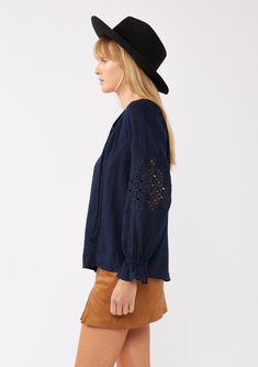 Meet your new boho favorite—our ultra-flowy peasant blouse, crafted from a dreamy rayon and linen blend for a cool, breathable feel. Featuring long sleeves with pretty embroidered lace details, ruffled elastic cuffs, and a split v-neckline with ties. Tuck it into your favorite denim for an effortless Fall ensemble that feels as timeless as it looks. Embroidered Lace insert Relaxed fit Long sleeve Ruffled elastic wrist cuff Hip length Split v-neckline with ties Women's bohemian top Dry clean recommended or hand wash cold Model is 5'9, wearing a size S.Style: I-15434W-SAH Fall Peasant Top With Ruffles, Long Sleeve Peasant Blouse In Rayon, Fall Rayon Peasant Top, Peasant Style Long Sleeve Rayon Blouse, Fall Peasant Top With Blouson Sleeves And Flowy Fit, Fall Peasant Top With Blouson Sleeves, Peasant Blouse With Smocked Cuffs For Fall, Fall Peasant Top With Smocked Cuffs For Brunch, Fall Peasant Blouse With Smocked Cuffs