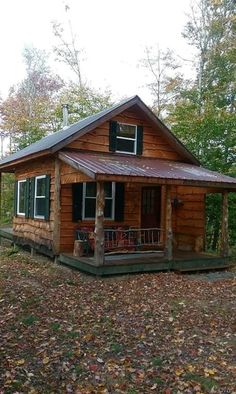 a small wooden cabin in the woods