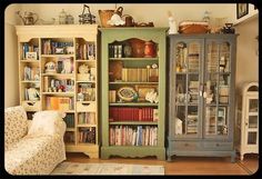 a living room filled with lots of furniture and bookshelves next to each other