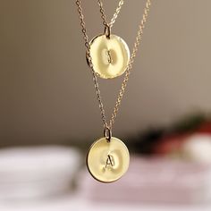 Delicate gold initial disc necklace. Personalized hand stamped gold filled or silver circle necklace. Perfect everyday necklace and great for layering with longer chains or a sweet gift for moms, sisters or friends. *** 14k gold filled, rose gold filled or sterling silver disc. *** Initials stamped by hand. *** Satin finish, hammered or hammered edge. ***Chain is 16"to18"adjustable Disc measurement : 1/2" inches (13mm) diameter. You can choose material ( sterling silver , yellow gold filled or r Rose Gold Initial Necklace With Delicate Chain, Dainty Hand Stamped Yellow Gold Necklaces, Delicate Round Charm Necklaces For Layering, Dainty Hand Stamped Yellow Gold Necklace, Dainty Hand-stamped Yellow Gold Necklace, Dainty Hand Stamped Round Necklaces, Rose Gold Hypoallergenic Round Charm Necklace, Delicate Yellow Gold Round Disc Necklace, Hypoallergenic 14k Gold-filled Round Necklace