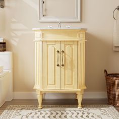 a bathroom with a sink, mirror and rug