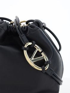 100% Calf Leather Bos Taurus Designer Crossbody Bag With Logo Plaque, Gold Crossbody Bag With Logo Plaque, Gold Leather Bag With Logo, Elegant Crossbody Bag With Logo Plaque, Gold Evening Bag With Logo Plaque, Luxury Crossbody Bag With Logo Plaque, Black Bag With Logo Plaque, Luxury Bags With Logo Plaque For Everyday Use, Designer Shopping Bag With Metal Logo