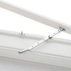 an image of a white ceiling with metal brackets