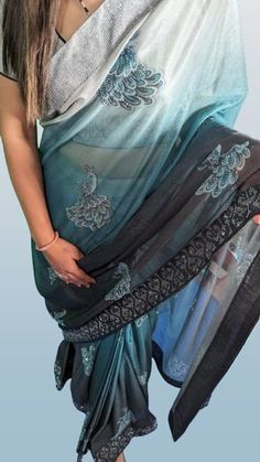 Description: (Fh_Sar006) Elevate your style with our exquisite ready-made saree in a stunning combination of turquoise blue, black, and grey. Crafted from fine imported fabric, this saree is a masterpiece of elegance and sophistication. The entire ensemble is adorned with intricate diamond work, adding a touch of glamour to your look. ✨ Key Features: Fabric: Made from fine imported fabric, ensuring a luxurious and comfortable drape. Colors: A captivating blend of turquoise blue, black, and grey, creating a harmonious and chic color palette. Diamond Work: Adorned with meticulous diamond work all over the saree, enhancing its opulence. 👗 Ready-to-Wear Perfection:Experience the ease of dressing with our ready-made saree. No fuss with pleats or drapes--just slip into this beautifully crafted Designer Turquoise Georgette Dupatta, Elegant Turquoise Dupatta With Zari Work, Turquoise Dupatta For Party, Elegant Turquoise Dupatta For Diwali, Elegant Turquoise Saree For Festivals, Blue Fitted Pre-draped Saree With Self Design, Turquoise Semi-stitched Saree With Self Design, Semi-stitched Turquoise Saree With Self Design, Light Blue Bollywood Saree