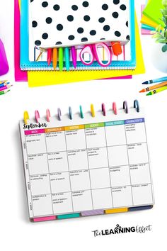 a calendar with markers and pencils on it