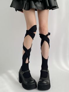 Get ready to turn heads with these white/black asymmetrical bandage stockings! This striking pair of stockings features a unique asymmetrical design that adds an edgy and stylish touch to any outfit.  Please note that this product includes only one pair of stockings. Trendy Black Knee-high Socks For Party, Black Stretch Knee-high Socks For Party, Fitted Black Knee-high Socks For Spring, Trendy Black Knee-high Legwear, Black Fitted Harajuku Leg Warmers, Trendy Black Leg Warmers For Cosplay, Trendy Stretch Knee-high Socks For Party, Punk Style Thigh High Stockings For Cosplay, Black Edgy Leg Warmers For Cosplay