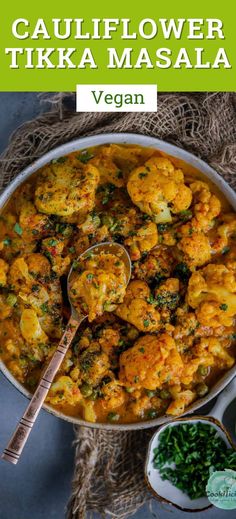 cauliflower tikka masala in a bowl with a spoon