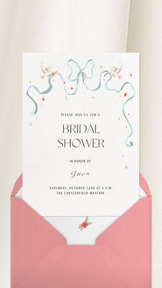 a pink envelope with the words bridal shower on it, and an image of flowers