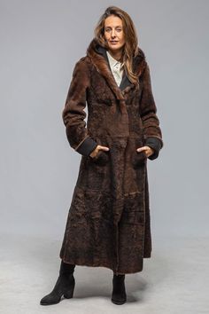 This shearling coat checks all the boxes; in addition to being delightfully soft and lightweight, it is incredibly warm; it features a luxurious soft shawl collar that is both elegant and necessary to protect you from the elements; and it is black AND brown which essentially means it goes with everything! 100% Italian shearling 2 buttons with additional collar button Foldable cuffs to accommodate any sleeve length Flattering slash side pockets that are positioned in the front and not on your hips! True to size. Model wears size 42, which comfortably fits over a heavy sweater, lightweight leather jacket, or blazer. (Height 5'8", Waist 28", Bust 34.5", Shoulder to Shoulder 16", usually wears size US 4/6) Made in Italy Soft Shawl, Travel Jacket, Heavy Sweaters, Check Coat, Mac Jeans, Knit Outerwear, Mens Vests, Selvedge Denim, Sport Dress