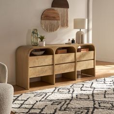 a living room with a rug and furniture