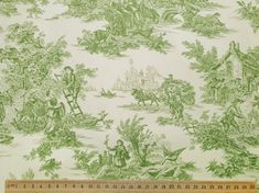 a ruler is next to a wallpaper with green and white images on it,