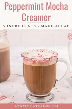 peppermint mocha creamer in a glass mug with whipped cream and sprinkles