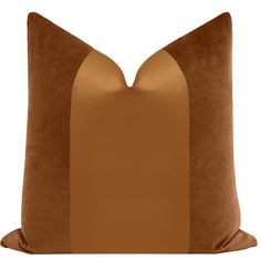 a brown and tan pillow on a white background