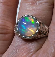 Stunning Natural Opal Art Nouveau Style Ring, 9mm Round Ethiopian Opal,  See Video! 925 Sterling Silver Floral Setting, Size 6.25. Velvet Ring Box Included. Heirloom Opal Ring With Polished Finish Gift, Silver Sterling Silver Opal Ring, Spiritual Silver Opal Ring For Anniversary, Sterling Silver Opal Ring With Polished Finish, Iridescent Sterling Silver Round Jewelry, Iridescent Round Sterling Silver Jewelry, Sterling Silver Cabochon Opal Ring For Anniversary, Sterling Silver Round Opal Ring Gift, Sterling Silver Round Solitaire Opal Ring