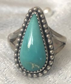 -Ladies turquoise gemstone ring -Genuine turquoise is teardrop cut. -Solid 925 Sterling Silver  -Beautiful and solid craftsmanship -Size 5 -This is the actual ring you'll receive.  -Combine shipping is available. Sterling Silver Teardrop Rings, Bohemian Teardrop Turquoise Ring In Silver, Southwestern Turquoise Teardrop Ring, Bohemian Silver Teardrop Turquoise Ring, Bohemian Silver Turquoise Teardrop Ring, Bohemian Teardrop Turquoise Ring, Bohemian Sterling Silver Turquoise Teardrop Ring, Southwestern Blue Turquoise Teardrop Ring, Turquoise Teardrop Gemstone Rings