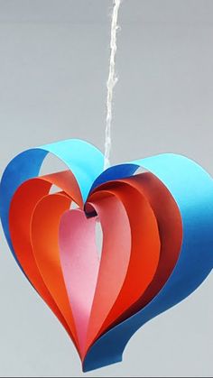 a paper heart hanging from a string