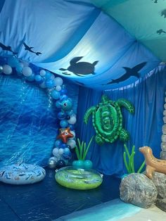 an ocean themed birthday party with balloons and decorations