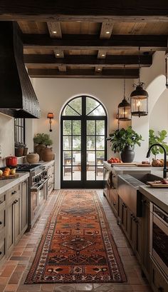 a kitchen with an area rug on the floor