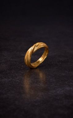 "Our beautiful Celtic Band is back. We really love this ring. It is very light and elegant. Simple yet filled with beautiful detail and twisting forms. It is one of the first rings we ever made and we still consider it one of our best! This is a solid silver ring with Double D gold plating. All of our jewelry are handcrafted by us. As we say, we became sculptors first and jewelers second. We find something beautifully romantic in taking a piece of wax and slowly sculpting it into a piece that ca Elven Ring, Celtic Band, Hammered Gold Ring, Celtic Wedding Rings, Romantic Gifts For Her, Natural Jewelry, Celtic Rings, Twisted Band, Friendship Bracelets Diy